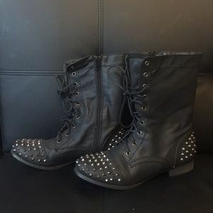 Combat style boot with spikes on toe and heel